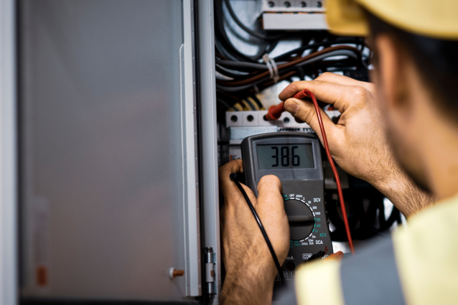 Infrared electrical testing being performed on commercial electrical equipment using thermal imaging technology