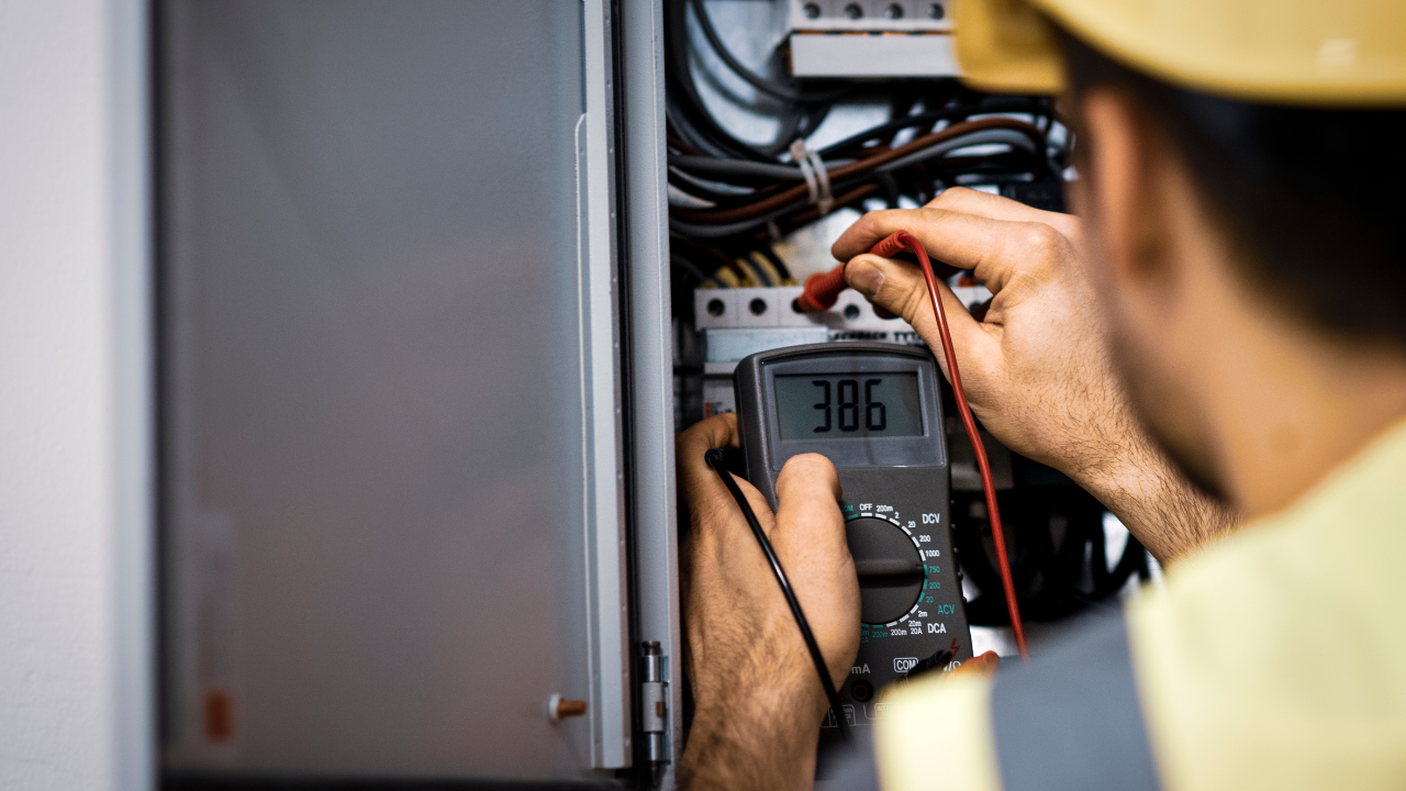 Infrared electrical testing being performed on commercial electrical equipment using thermal imaging technology